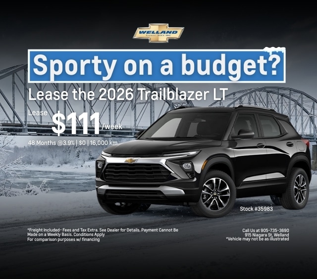 Black 2026 Chevrolet Trailblazer LT displayed with a promotional lease offer of $111 per week for 48 months at 3.9% interest. The image highlights the vehicle's sporty design against a winter backdrop, promoting affordability and style. Contact information for Welland dealership included.