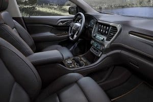 Interior view of a modern SUV showcasing premium leather seating, an advanced dashboard with infotainment system, and well-designed center console, emphasizing comfort and luxury for passengers.