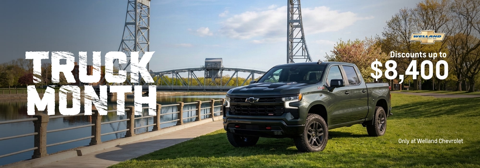 Chevrolet truck by a bridge with text: "Truck Month, Discounts up to $8,400" at Welland Chevrolet.